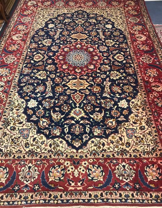 An Isfahan ivory ground carpet 340 x 235cm